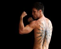 He has a tattoo depicting the Vergina Sun on his back.